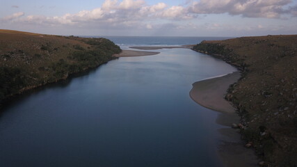 Aerial view of a lagoon going into the ocean. Wild Coast, Eastern Cape