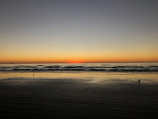 Naklejka na ściany i meble Sunrise over the beach in Port Aransas, Tx.