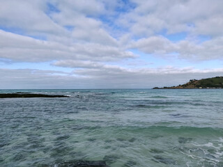 Landscape view of cobalt blue sea nd cloudy sky