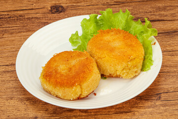 Vegan cuisine - Potato cutlet in the plate