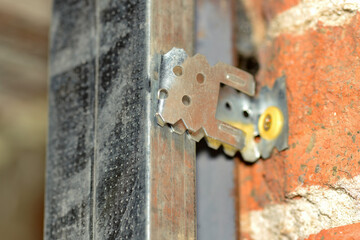 Fixing drywall profile to the wall, closeup.
