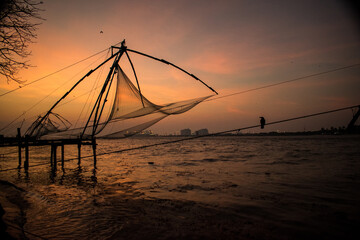 Fototapeta na wymiar sunset on the beach kochi nets