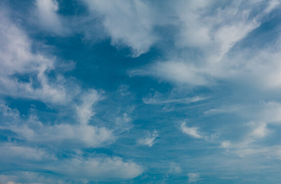 Clear blue sky with partly cloud. Use as a background or wallpaper. 