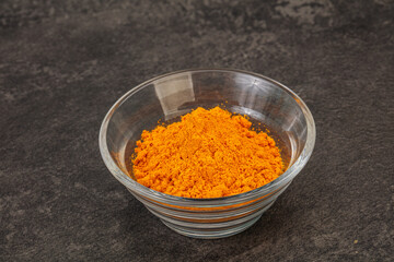 Tumeric powder in the bowl