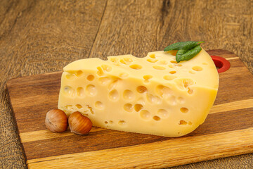 Maasdam cheese - yellow triangle with holes