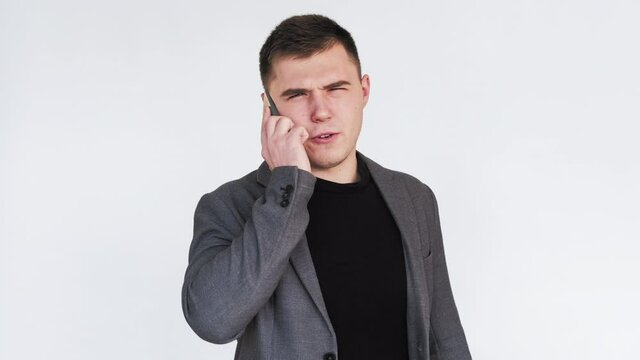 Phone scam. Communication fraud. Business man receiving annoying spam call isolated on white background.