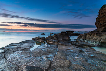 Sunrise Seascape with Clouds and Ships on the Horizon