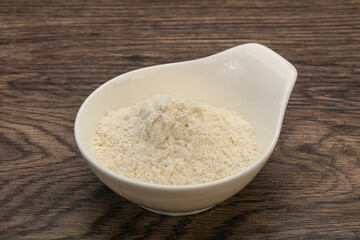 Wheat flour heap in the bowl