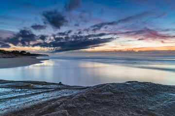Sunrise Seascape with Clouds and Ships on the Horizon