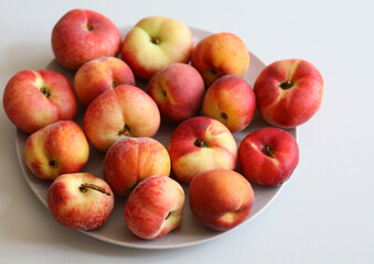 Fototapeta na wymiar ripe juicy peaches on a white background close up