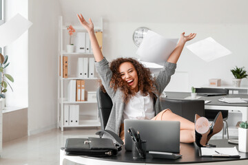 Happy businesswoman before weekends in office