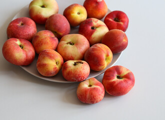 ripe juicy peaches on a white background close up
