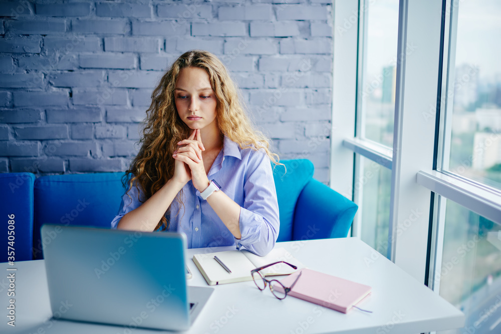 Poster attractive graphic designer developing website on computer in coworking