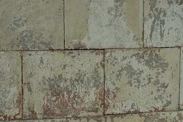 gray brown stone texture from old shabby concrete blocks in the wall