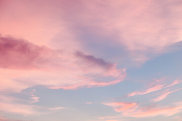 Fototapeta premium Pink cloud on blue sky. Soft pastel filter.