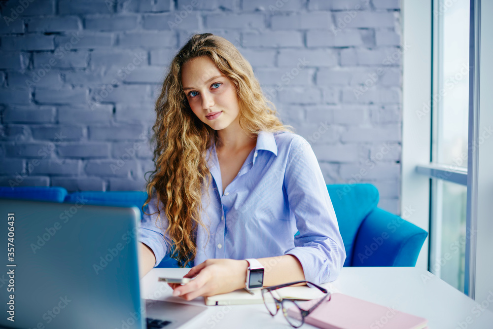 Poster attractive graphic designer developing website on computer in coworking