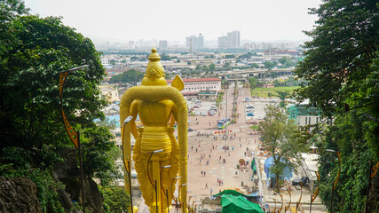 Huge golden Murugan statue known as the Hindu god of war Kartikeya at the Batu Caves in Kuala...