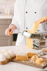 Woman preparing pasta in kitchen, closeup