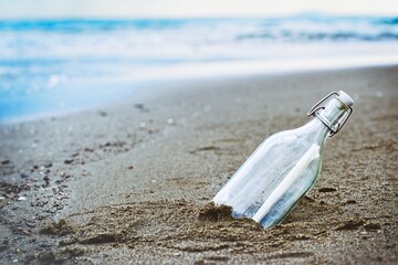 Message in a bottle thrown on a coast