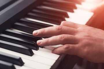 Obraz premium Man playing piano close up