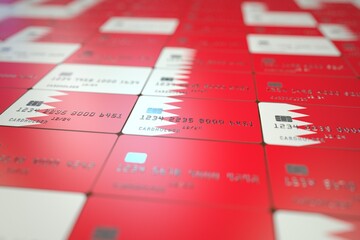 Flag of Bahrain on plastic bank cards. National banking related 3D rendering