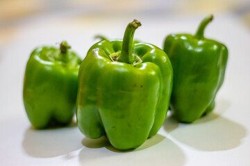 Fresh green capsicum or bell pepper isolated on a white background
