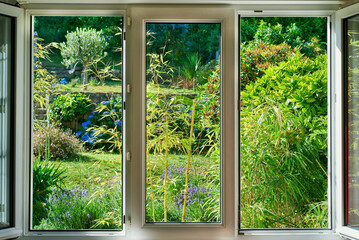 window with view of flower garden