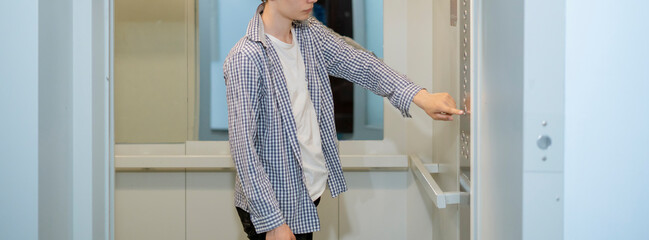 young man in casual come inside the lift elevator cabin © Mihail