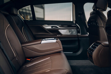 Luxury car rear seat row with armrest