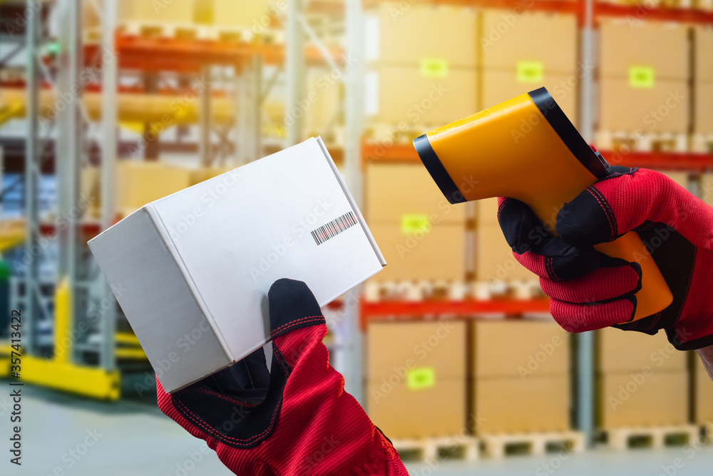 Poster reading a barcode from a cardboard box. hands in work gloves hold a barcode reader and a box. accept