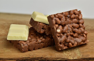 Nutrition, diet and junk food. Chocolate crispies sweets and white chocolate set one next to the other.