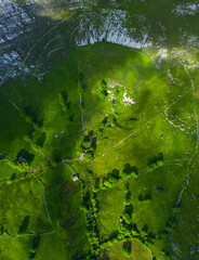Spring landscape of mountains, meadows of mowing and cabins pasiegas in the Valle del Miera, Cantabria, Spain, Europe