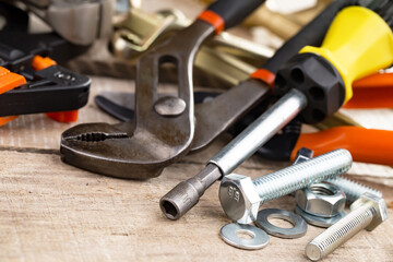 Fototapeta premium Different tools on the old background.