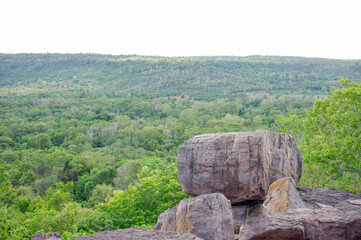 Large rock on the edge of a high cliff