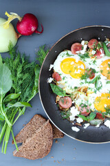 fried eggs with vegetables