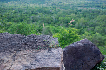Large rock on the edge of a high cliff