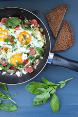 fried eggs with vegetables