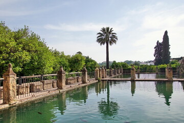 Fototapeta na wymiar View of the gardens of the Alcazar of the Christian Monarchs, Alcazar de los Reyes Cristianos in Cordoba, Andalusia, Spain