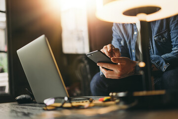 Man pointing on smartphone screen, male hands, close up