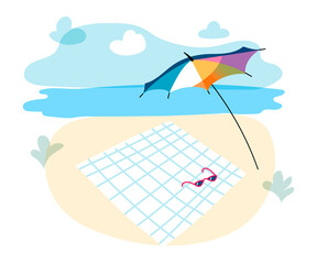 Sun shade umbrella and towel lie on sand. Beachfront landscape background