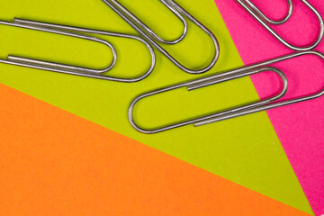 Office and school background using coloured post it notes and paperclips