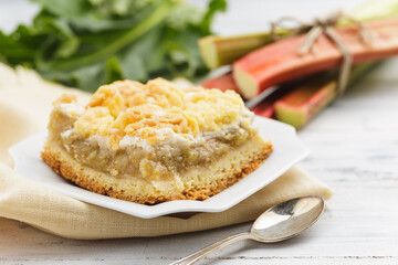 Piece of homemade rhubarb pie on white plate