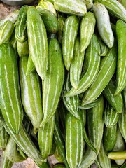 Snake gourd vegetables in market.