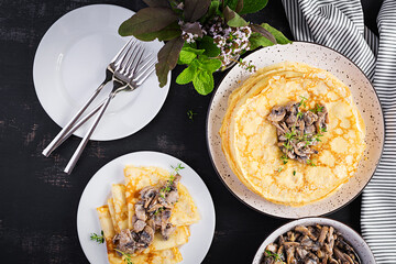 Pancakes with mushrooms.  Homemade baking. Maslenitsa week. Maslenitsa. Top view, copy space