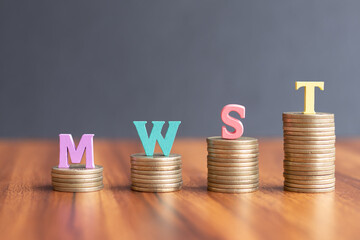 MWST or German Value Added Tax on coins in increasing order - concept showing of increase mwst or...