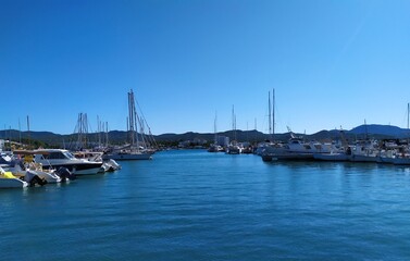 Ibiza, Port of San Antonio - October 16, 2019:boats at sea, mountains in the backround