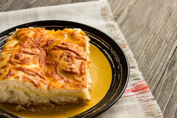 fresh Suluguni cheese pie on wooden background