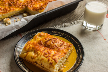 fresh Suluguni cheese pie on wooden background