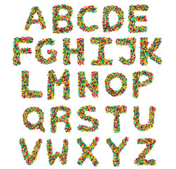  English alphabet  from multicolored round chocolates on a white isolated background. Food pattern made from children's candy. Bright alphabet for kids design