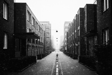 Black and white image of modern residential houses and a narrow street in the Nieuw West district Osdorp in Amsterdam